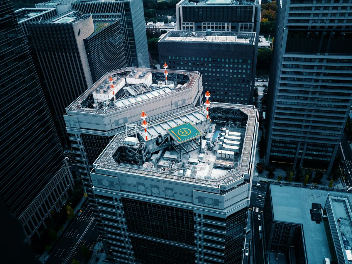 Aerial view of Manhattan towers with a rooftop landing area
